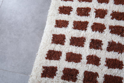 White and brown checkered moroccan rug